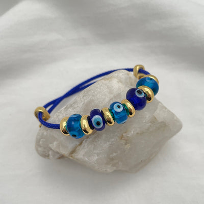 Evil Eye Lampwork Glass Bead Bracelet in blue and gold
